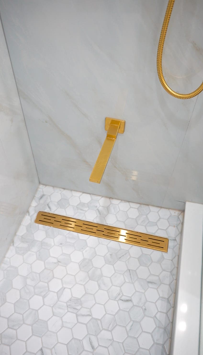 Hexagonal shower floor tile with linear drain detail