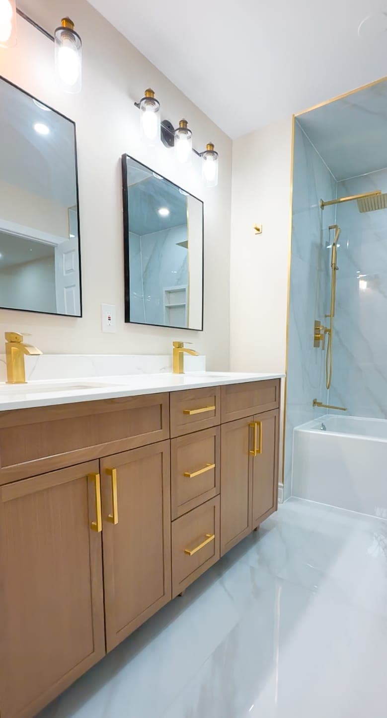 Double vanity bathroom with tub and shower in view