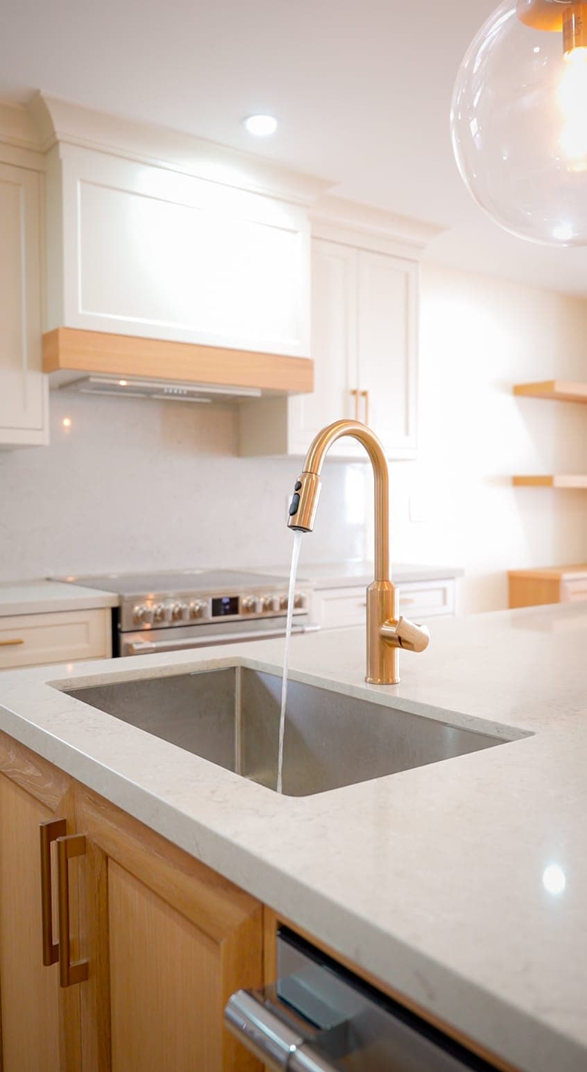 Kitchen island sink and gold faucet detail