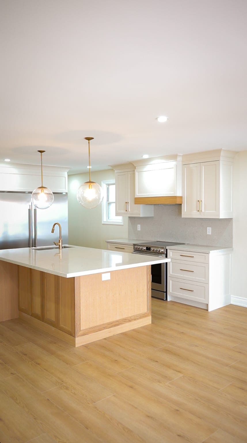 Wide view of the kitchen island and cabinetry