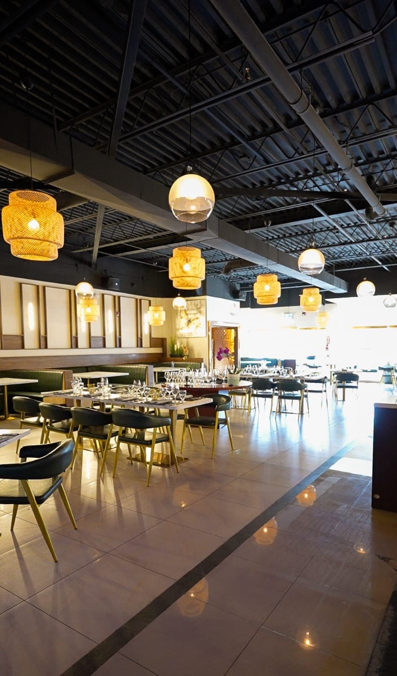Wide view of the restaurant dining room and pendant lighting