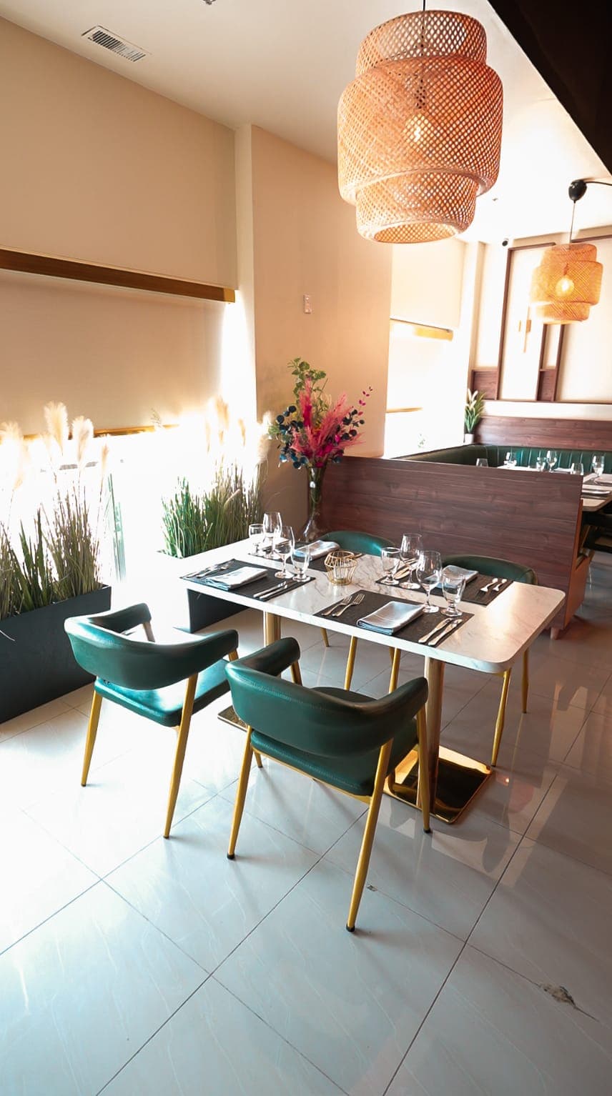 Restaurant table setting near a window with natural light
